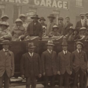 british-men-and-women-near-lowtiers-garage