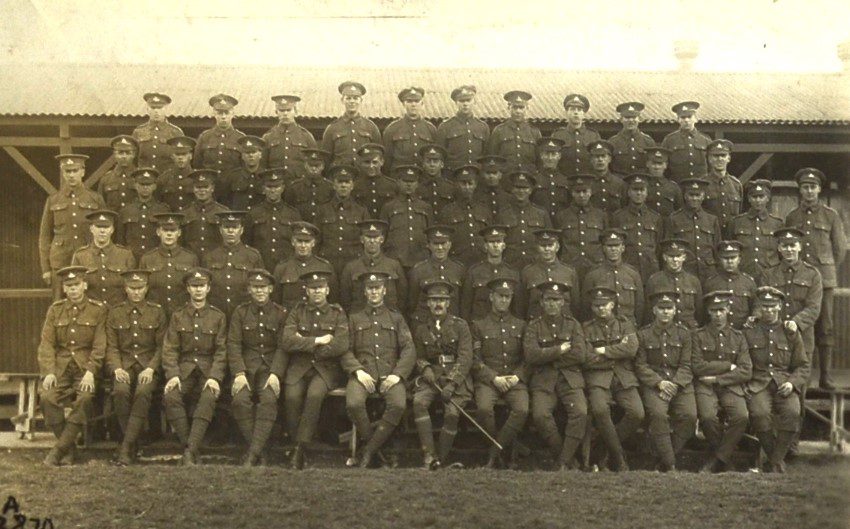 The Echoes Of War: Ww1 Through Unique Historical Photographs british-soldiers-with-a-commander-who-has-gloves-and-a-walking-stick.