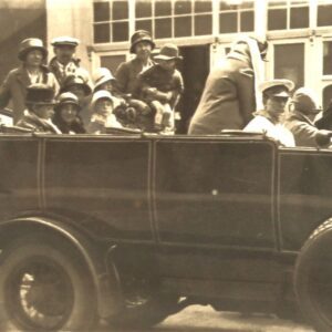 british-women-children-and-men-in-a-big-car.