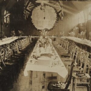 dinner-at-a-long-table-with-a-lot-of-chairs-and-british-flags