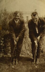 two-british-playing-golf-and-smoking