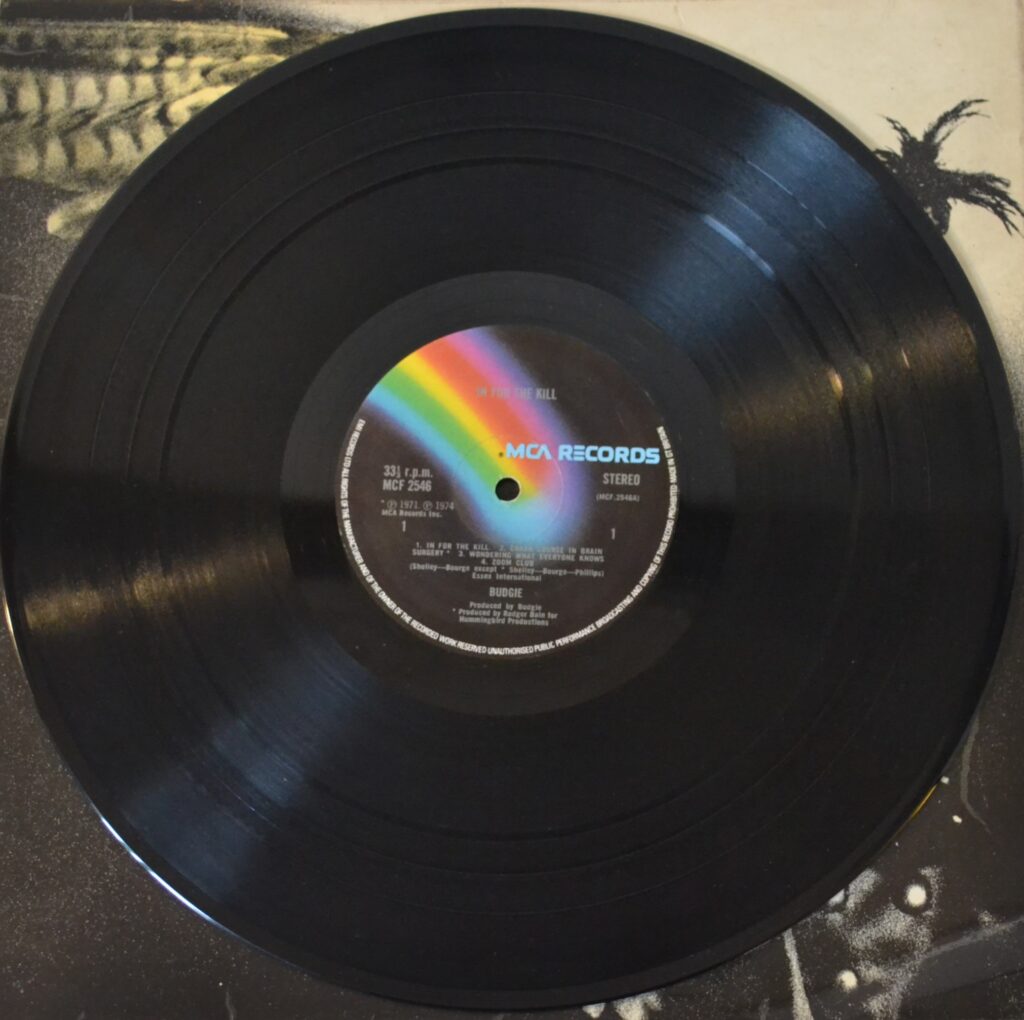 Budgie - In For The Kill!, I'M Only Trying To Help You Love In A World budgie-in-for-the-kill-record-side-one.