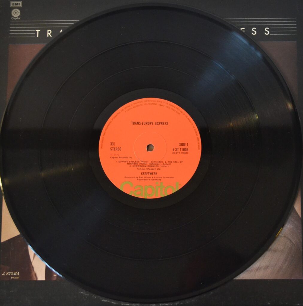 Kraftwerk Unlimited - Showroom Dummies In The Endless Hall Of Mirrors kraftwerk-trans-europe-express-record-side-one.