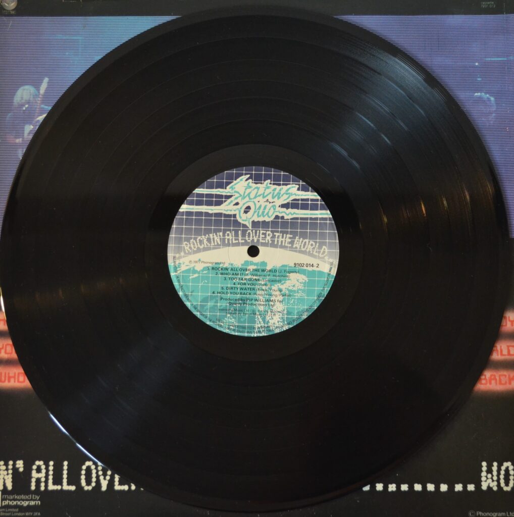 Status Quo - Rockin' All Over The World status-quo-rockin-all-over-the-world-record-side-two.