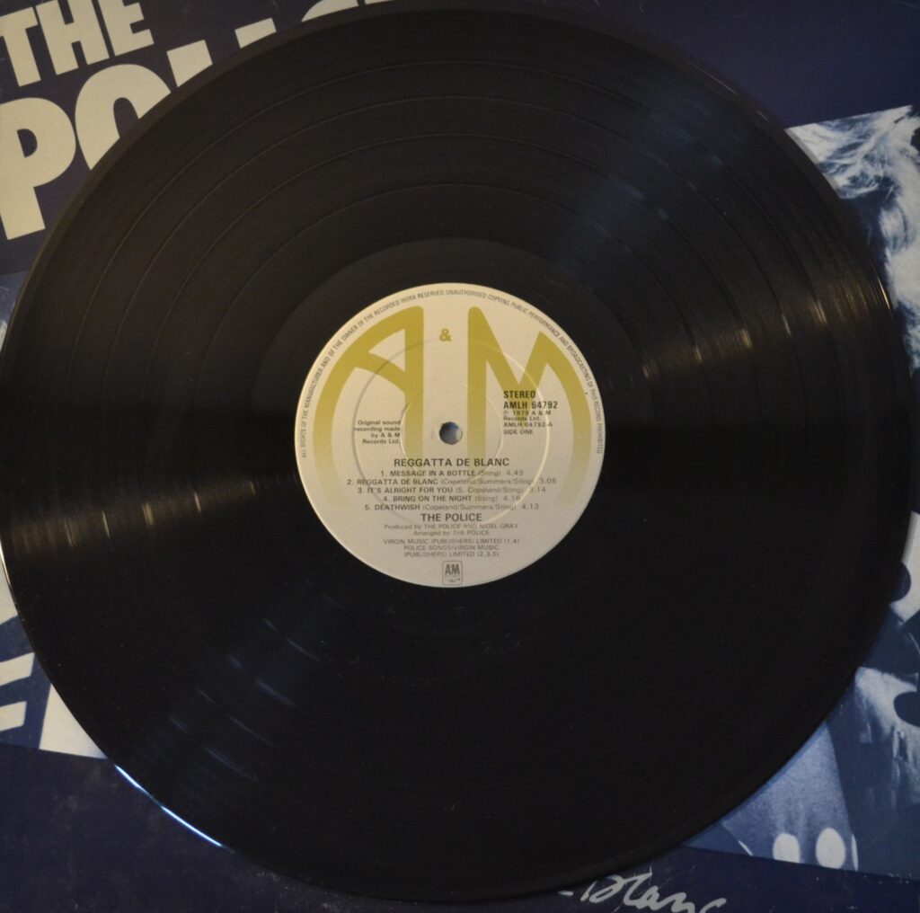 The Police - Reggatta De Blanc, Walking On The Moon the-police-reggatta-de-blanc-record-side-one.