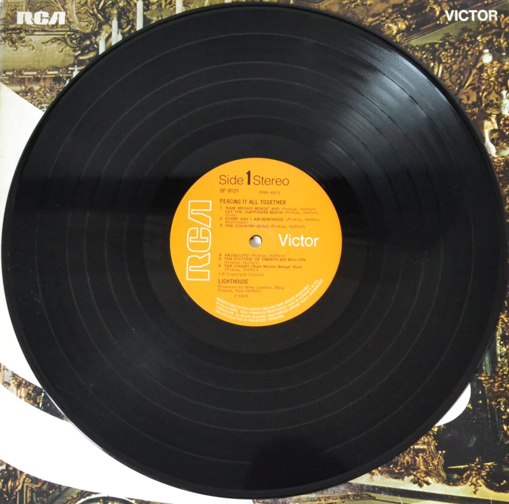 Lighthouse - Peacing It All Together And Let The Happiness Begin lighthouse-peacing-it-all-together-record-side-one.