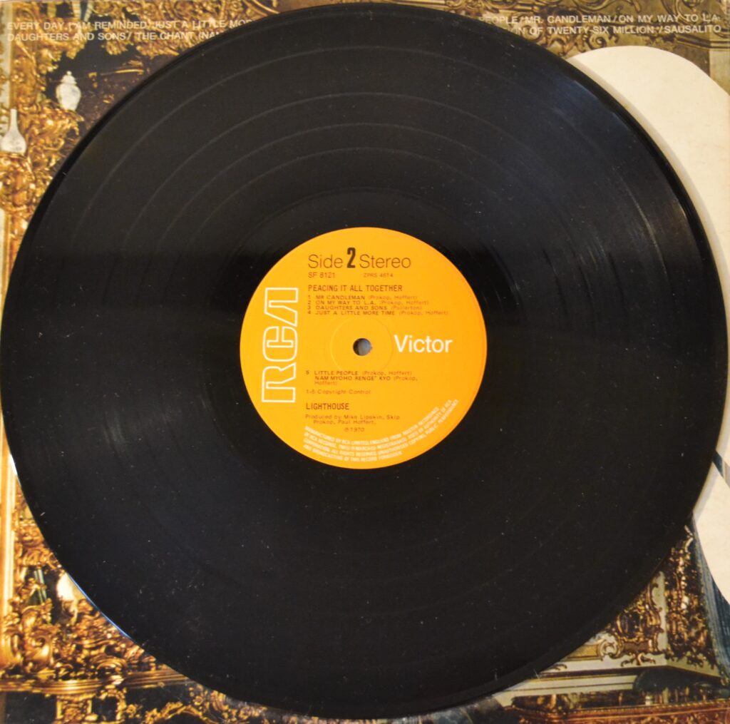 Lighthouse - Peacing It All Together And Let The Happiness Begin lighthouse-peacinhg-it-all-together-record-side-two-scaled.